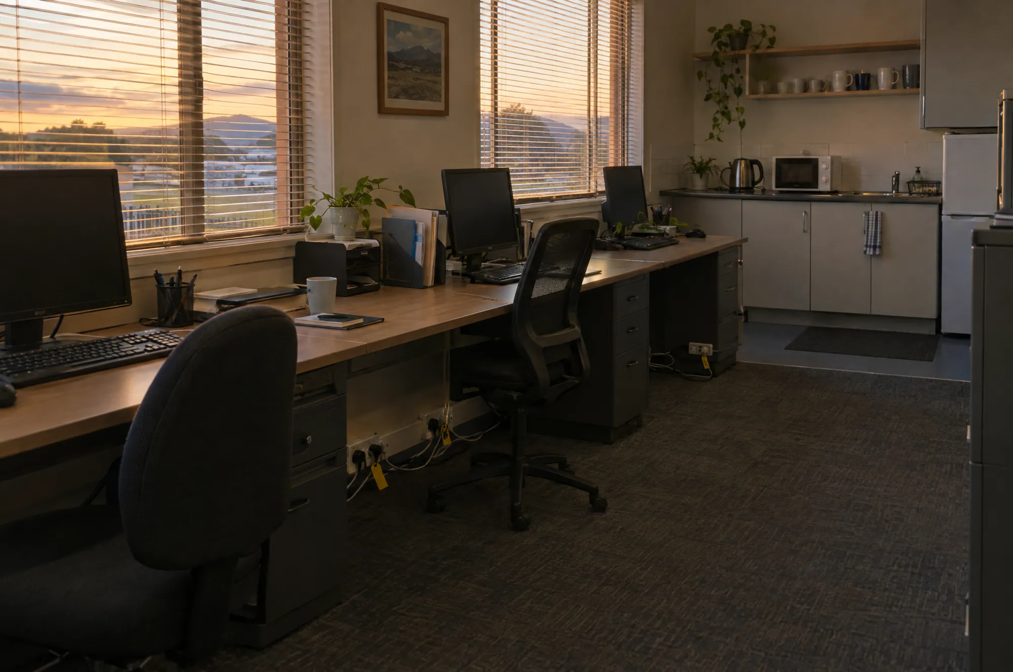 A small office with tagged extension leads along the desks